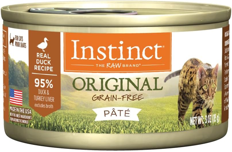 Nature's Variety wet cat food cans in assorted flavors on a kitchen counter